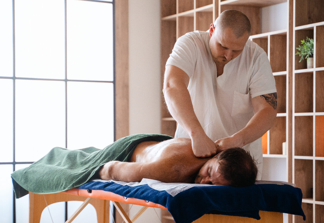 A Man Receiving A Massage In A Serene Room
