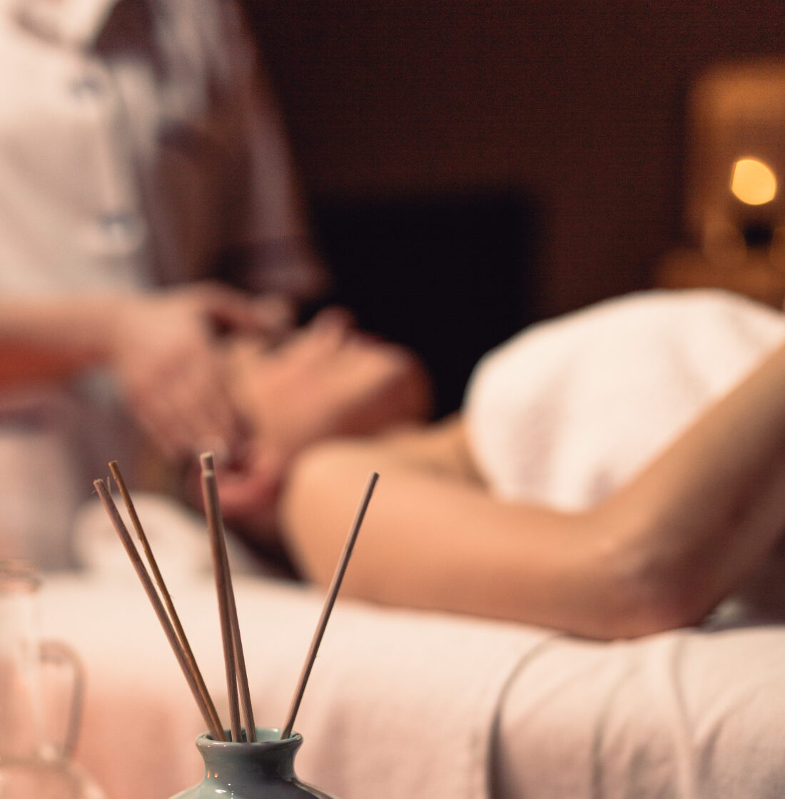 A Woman Receiving A Relaxing Massage In A Serene Spa Environment
